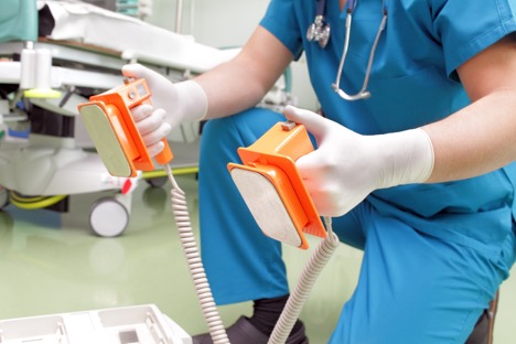 nurse holding medical defibrillators